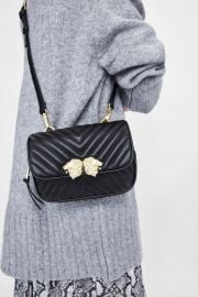 crossbody belt bag with lionhead detail at Zara